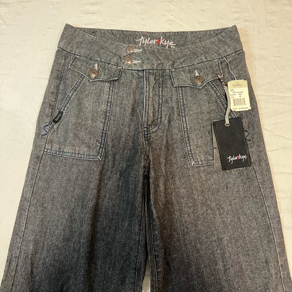 Grey low rise jeans w flare bottom.